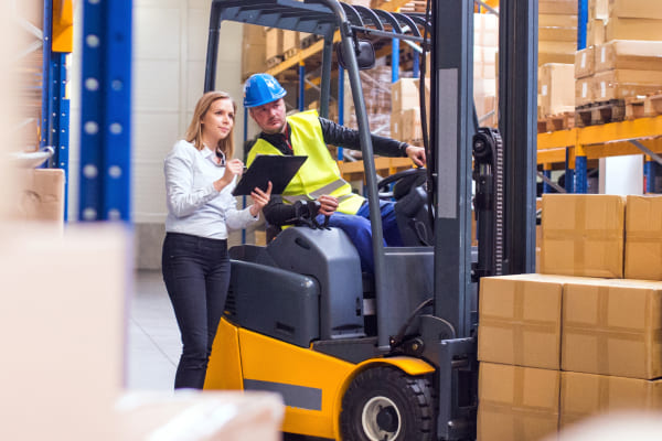 young warehouse workers working together 1