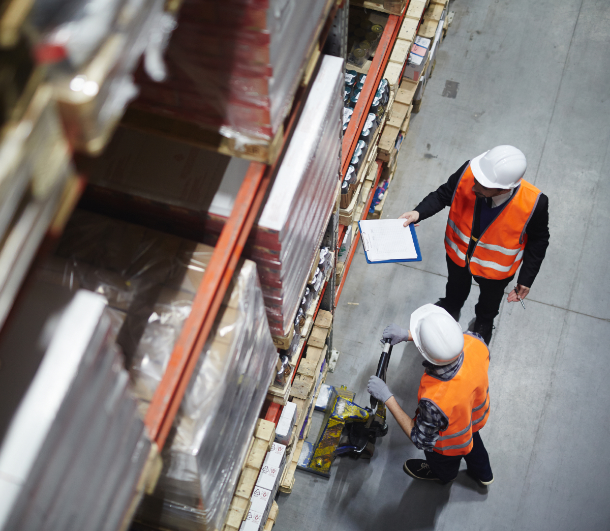 Warehouse employees checking inventory from an upper aisle perspective